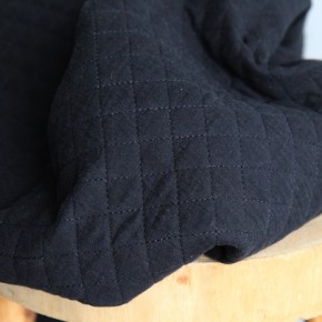 tissu matelassé noir - un chat sur un fil