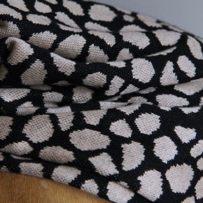 tissu en maille jersey léopard noir et beige