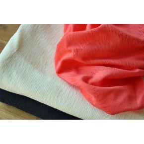 Maille ajourée losange corail