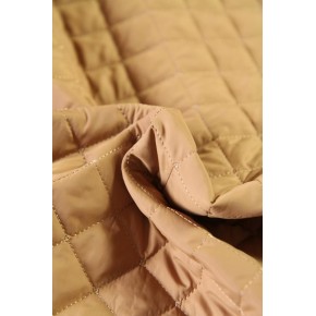 tissu matelassé beige - un chat sur un fil