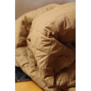 tissu matelassé pour une veste - beige et noir